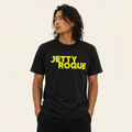 Black tee on model: Jetty Rogue unisex tee in black with lime logo, relaxed fit, worn by male model